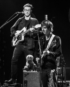 Amos Lee's band members performing at Uptown Theater in Kansas City, Missouri, on March 26, 2019.