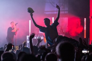 A fan crowdsurfing during I Prevail's performance