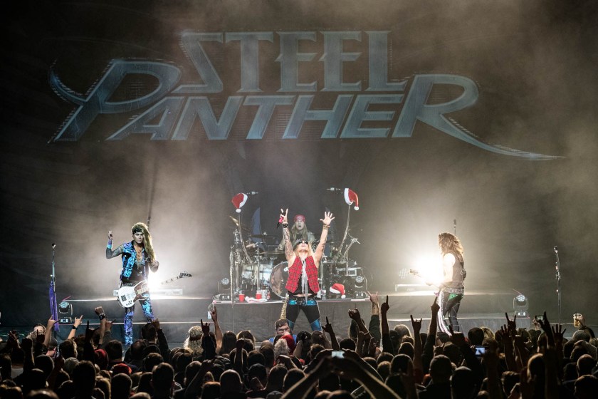 Steel Panther performing at the Arvest Bank Theatre at The Midland in Kansas City, Missouri on December 15, 2019.