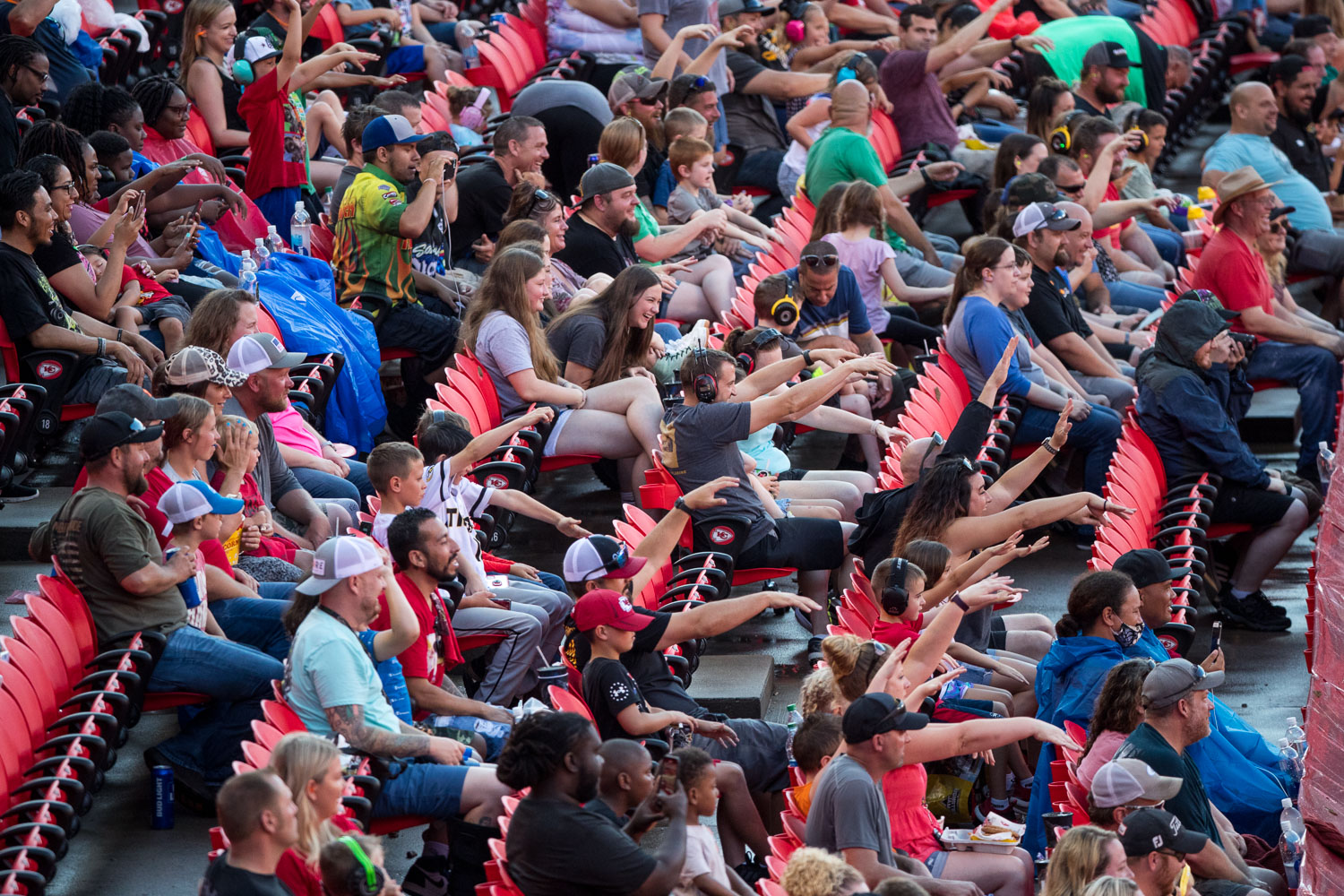 Fans throw up the zombie arms during Monster Jam at GEHA Field at Arrowhead on Saturday evening, June 26, 2021.