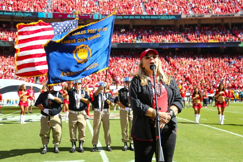 Melissa Etheridge singing the National Anthem prior to an NFL football game against the Los Angeles Chargers, Sunday, September 26, 2021 in Kansas City.