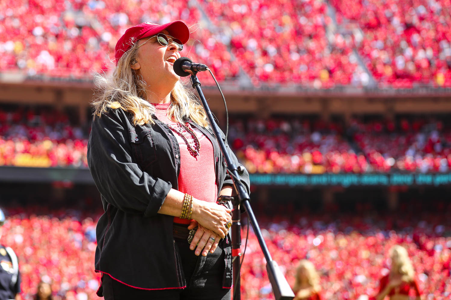 Melissa Etheridge singing the National Anthem prior to an NFL football game against the Los Angeles Chargers, Sunday, September 26, 2021 in Kansas City.