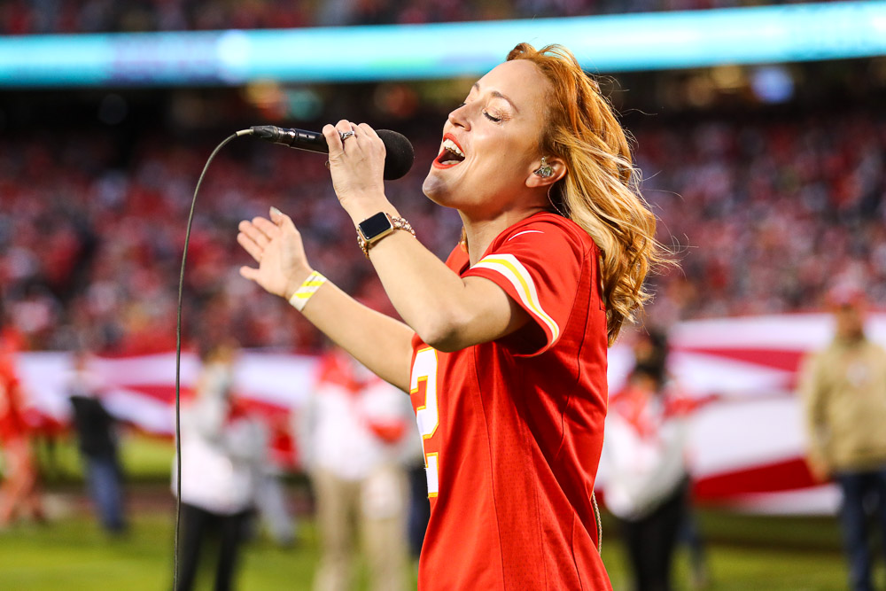 Casi Joy singing “God Bless America” at halftime during an NFL football game against the Dallas Cowboys, Sunday, November 21, 2021 in Kansas City.