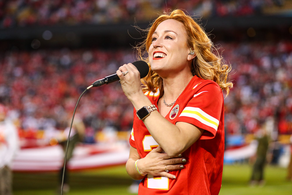 Casi Joy singing “God Bless America” at halftime during an NFL football game against the Dallas Cowboys, Sunday, November 21, 2021 in Kansas City.
