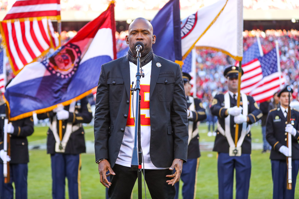 U.S. Navy Master Sergeant Robert Carter singing the National Anthem prior to an NFL football game against the Dallas Cowboys, Sunday, November 21, 2021 in Kansas City.