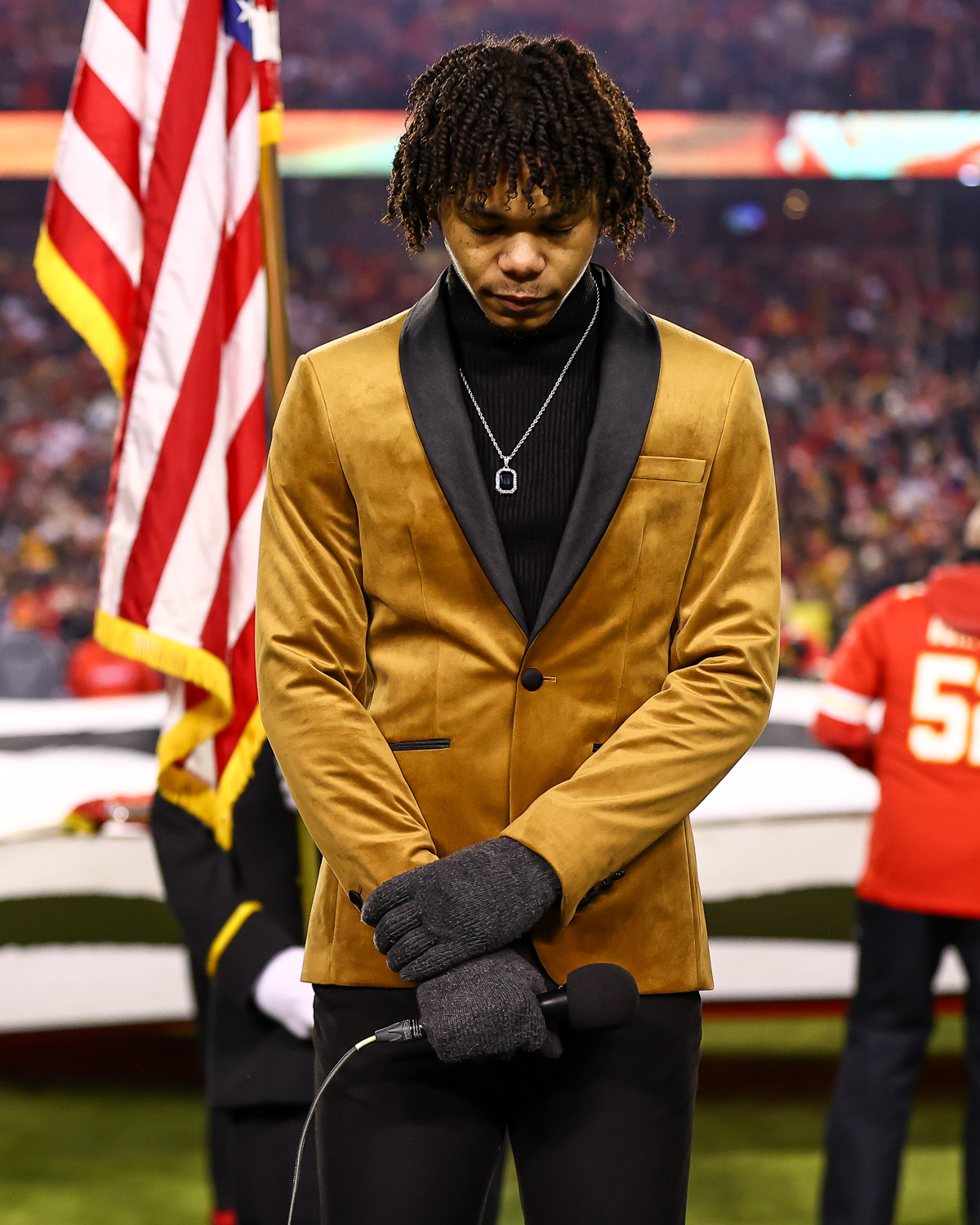 Cam Anthony, winner of season 20 of The Voice, sings the National Anthem prior to the wildcard playoff football game against the Pittsburgh Steelers, Sunday, January 16, 2022 in Kansas City.