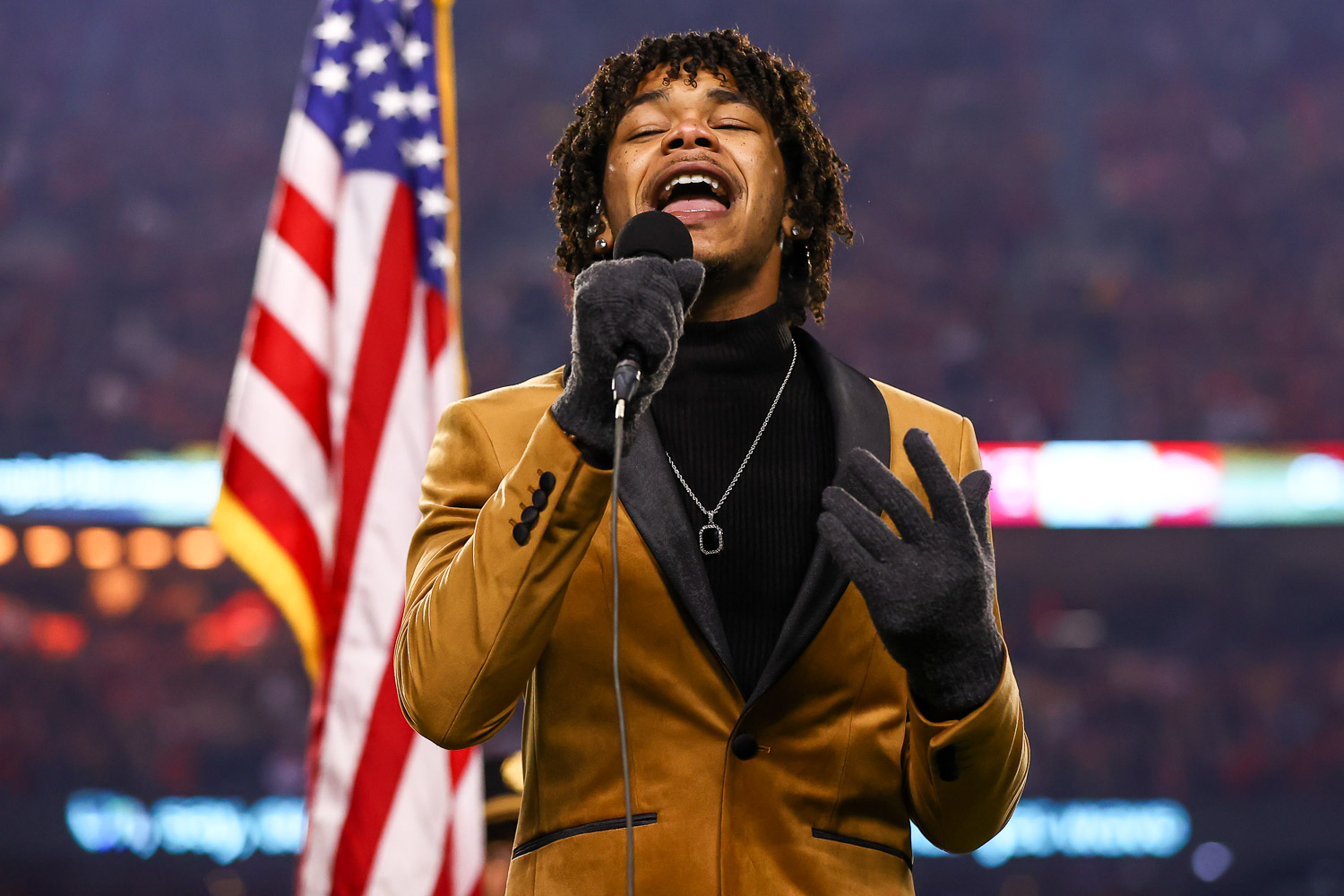 Cam Anthony, winner of season 20 of The Voice, sings the National Anthem prior to the wildcard playoff football game against the Pittsburgh Steelers, Sunday, January 16, 2022 in Kansas City.