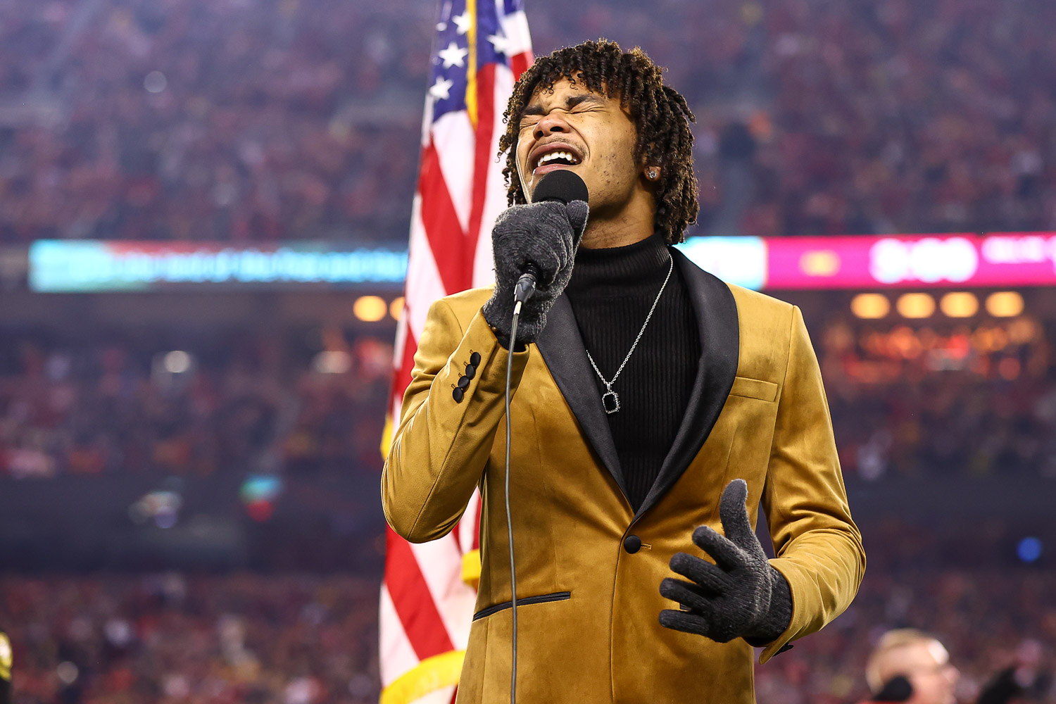 Cam Anthony, winner of season 20 of The Voice, sings the National Anthem prior to the wildcard playoff football game against the Pittsburgh Steelers, Sunday, January 16, 2022 in Kansas City.