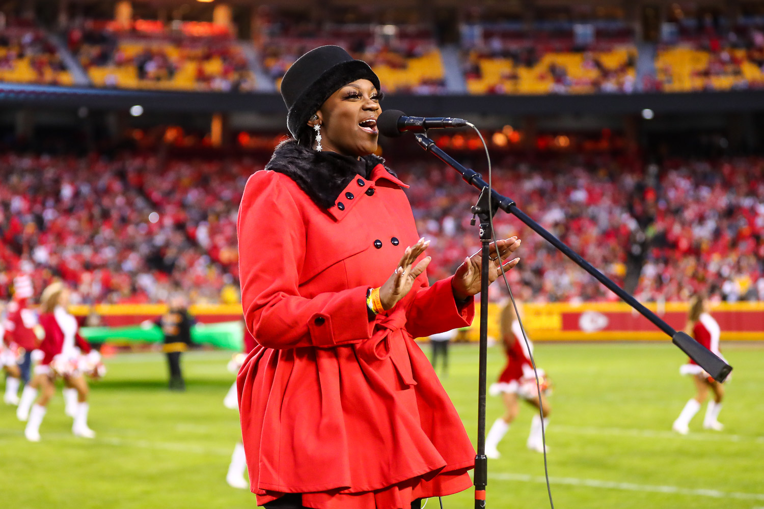 Singer/songwriter Symonne Sparks sings a holiday medley at halftime during an NFL football game against the Pittsburgh Steelers, Sunday, December 26, 2021 in Kansas City.
