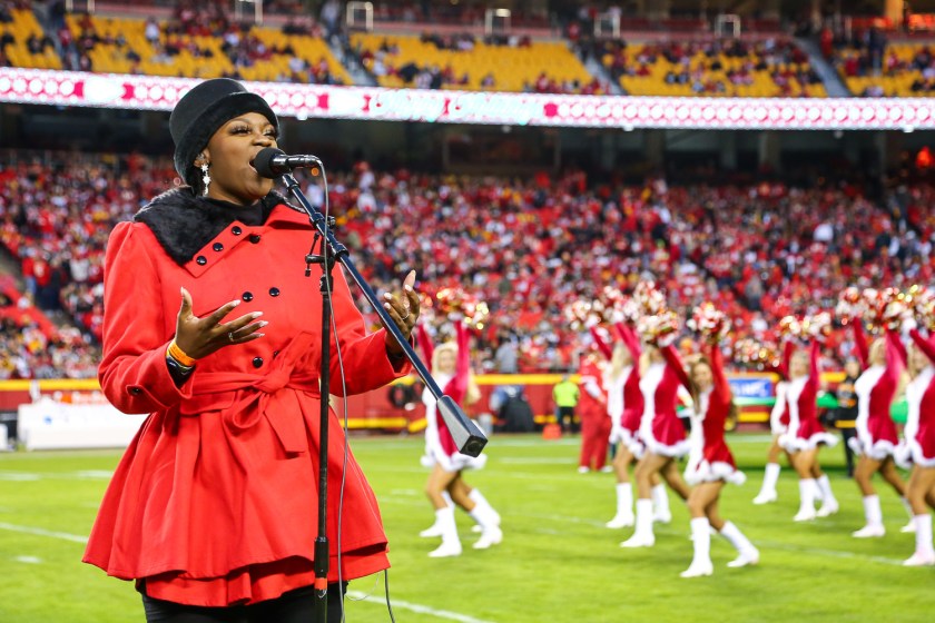 Singer/songwriter Symonne Sparks sings a holiday medley at halftime during an NFL football game against the Pittsburgh Steelers, Sunday, December 26, 2021 in Kansas City.