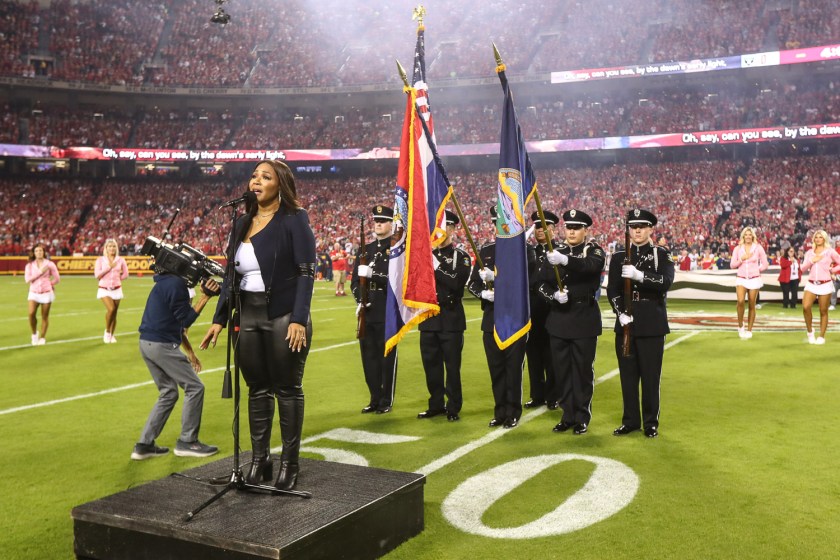 GRAMMY winning artist Erica Campbell singing the National Anthem prior to an NFL football game against the Las Vegas Raiders, Monday, October 10, 2022 in Kansas City.