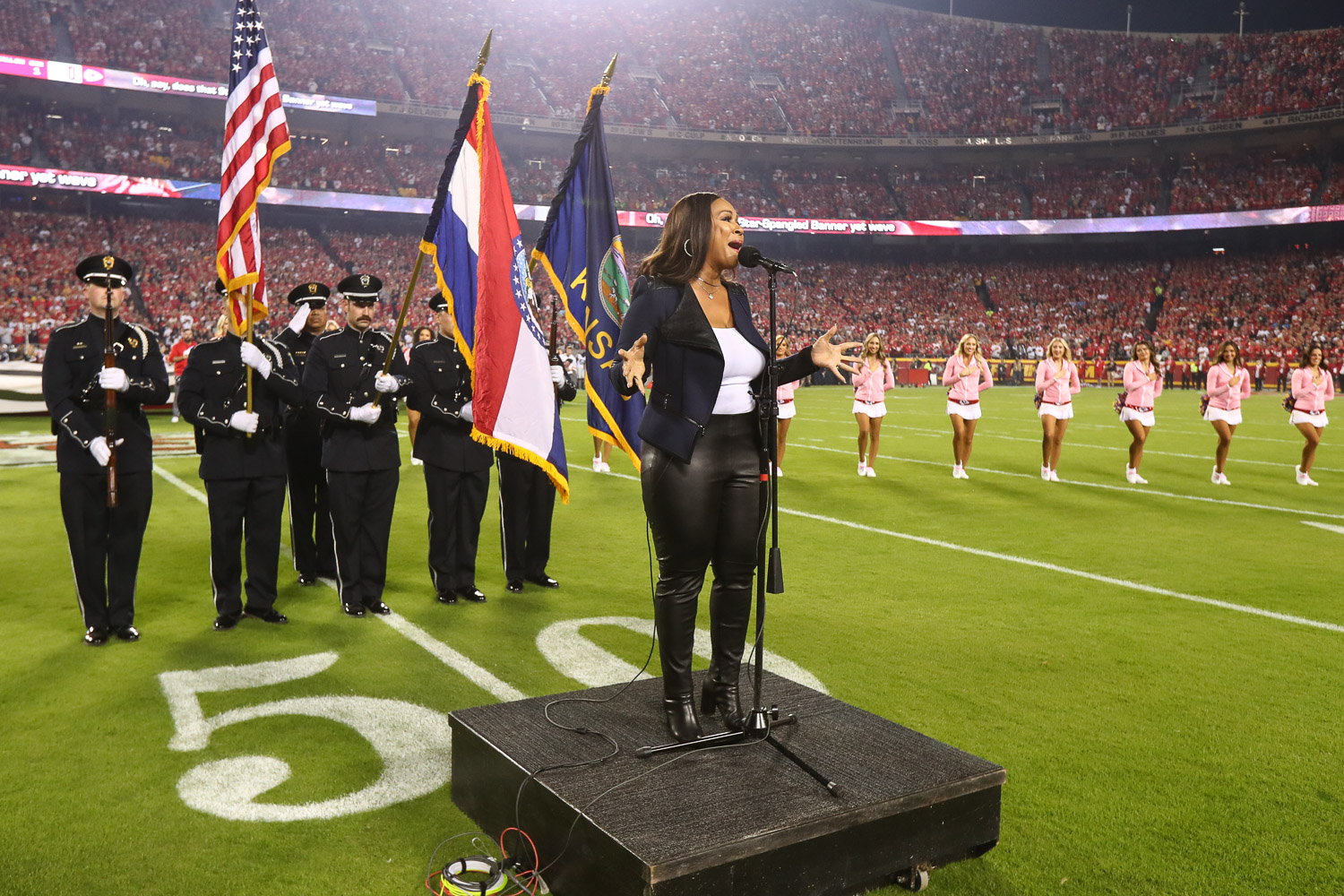 GRAMMY winning artist Erica Campbell singing the National Anthem prior to an NFL football game against the Las Vegas Raiders, Monday, October 10, 2022 in Kansas City.