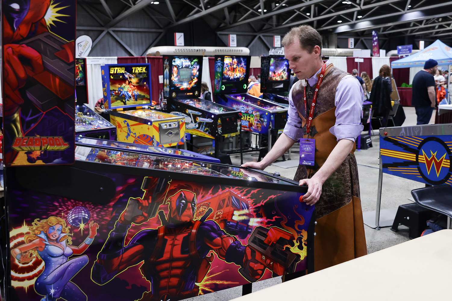A guest playing pinball on Friday at the 2023 Planet Comicon in Kansas City, Missouri on March 17, 2023.