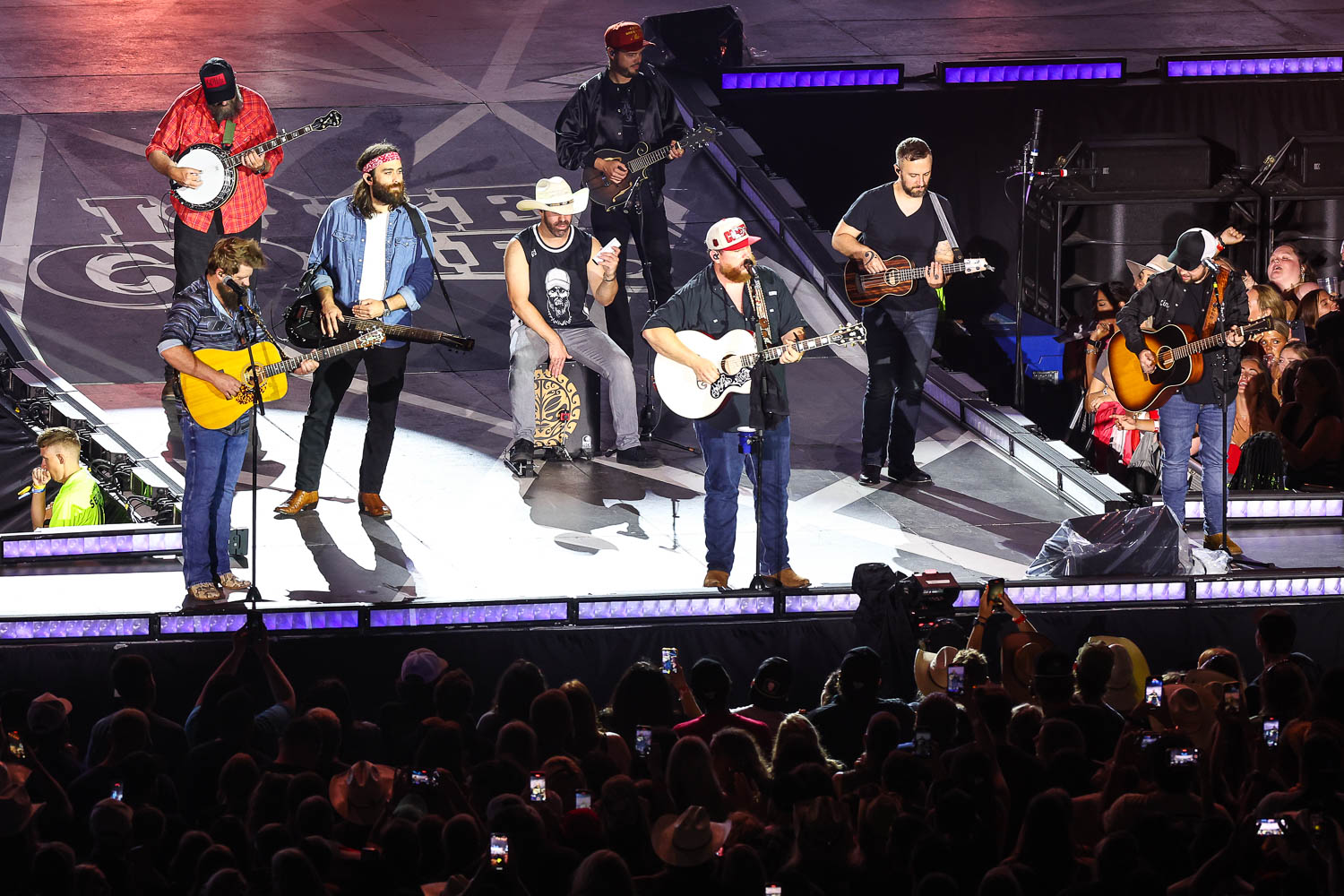 Luke Combs and band performing at GEHA Field at Arrowhead Stadium on Saturday, June 10, 2023.