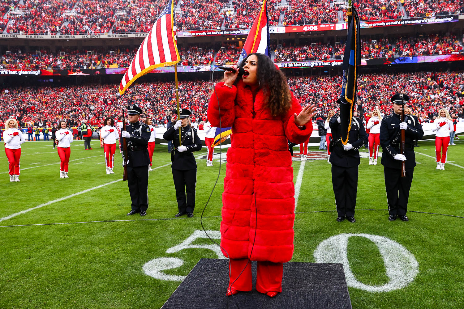American Idol season 16 contestant, Britney Holmes, sings the national anthem prior to the NFL Week 16 matchup against the Las Vegas Raiders on December 25, 2023.