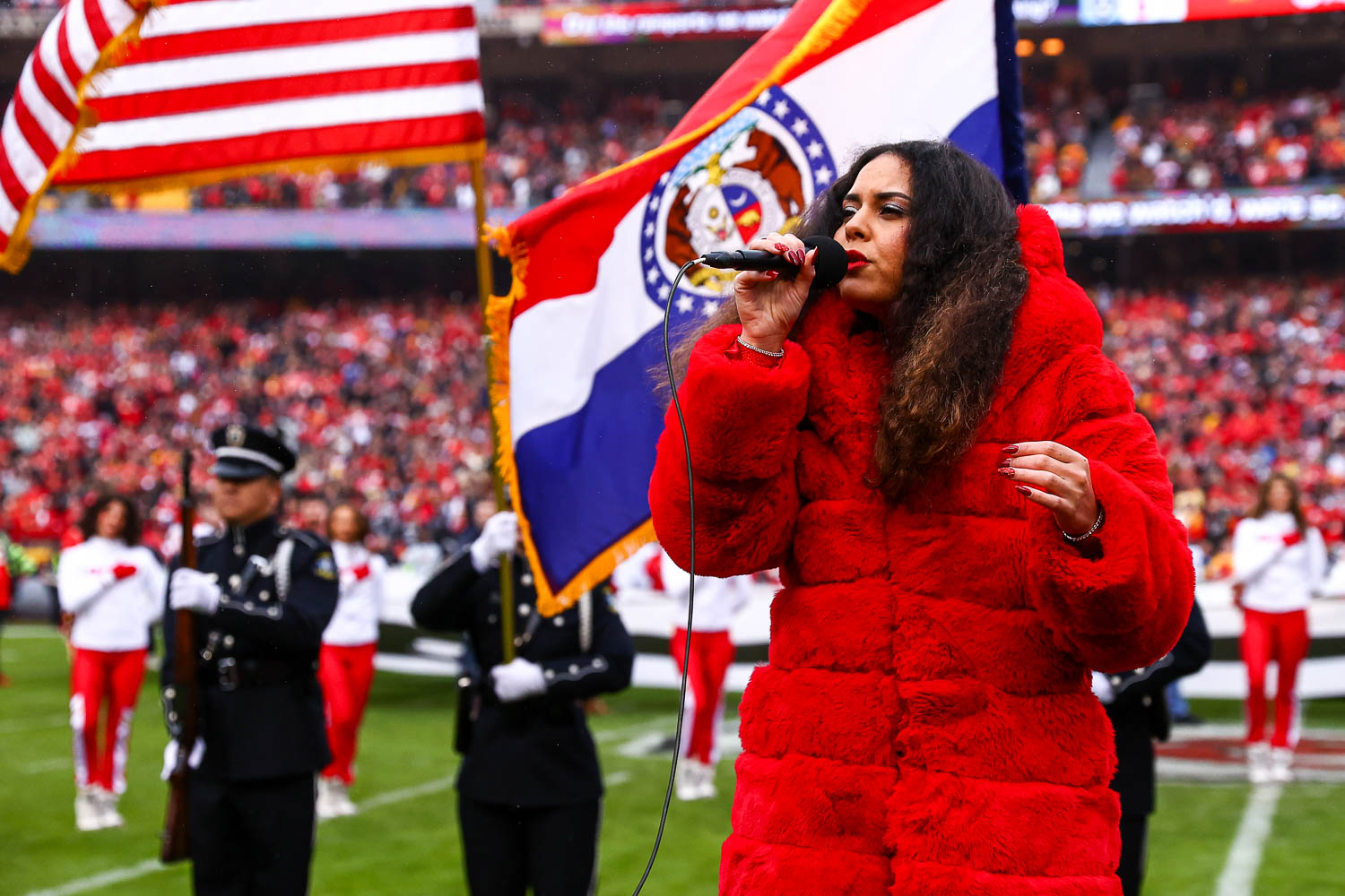 American Idol season 16 contestant, Britney Holmes, sings the national anthem prior to the NFL Week 16 matchup against the Las Vegas Raiders on December 25, 2023.