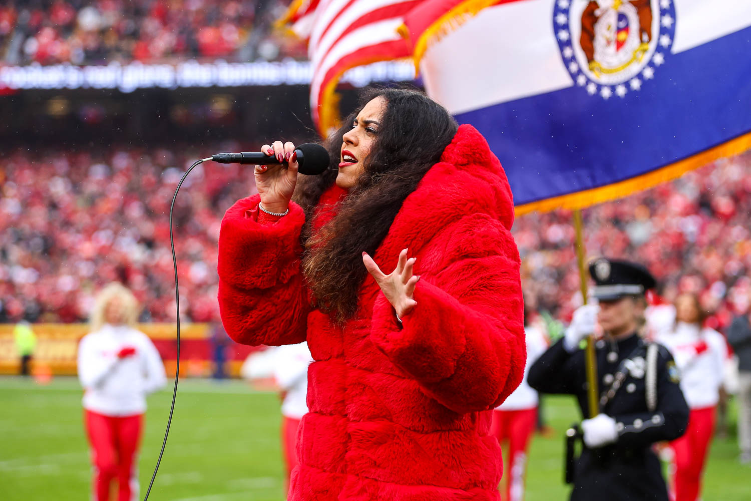 American Idol season 16 contestant, Britney Holmes, sings the national anthem prior to the NFL Week 16 matchup against the Las Vegas Raiders on December 25, 2023.