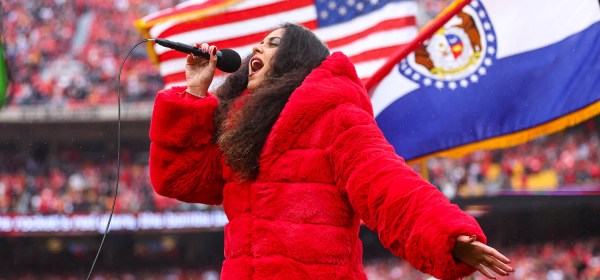 American Idol season 16 contestant, Britney Holmes, sings the national anthem prior to the NFL Week 16 matchup against the Las Vegas Raiders on December 25, 2023.