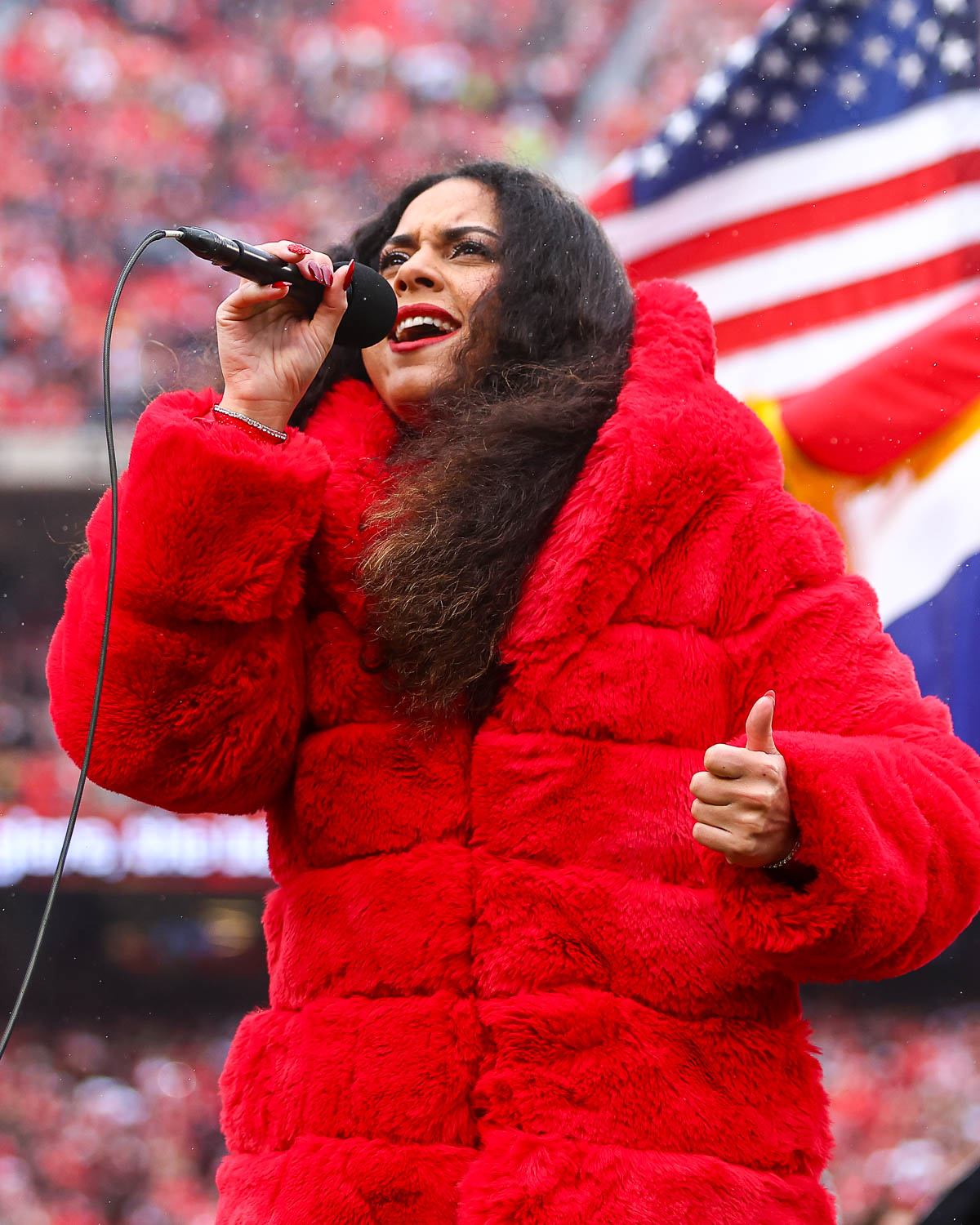 American Idol season 16 contestant, Britney Holmes, sings the national anthem prior to the NFL Week 16 matchup against the Las Vegas Raiders on December 25, 2023.