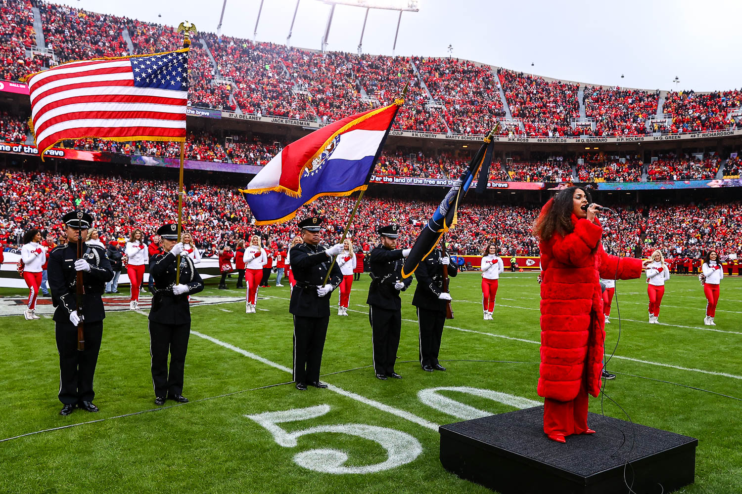 American Idol season 16 contestant, Britney Holmes, sings the national anthem prior to the NFL Week 16 matchup against the Las Vegas Raiders on December 25, 2023.