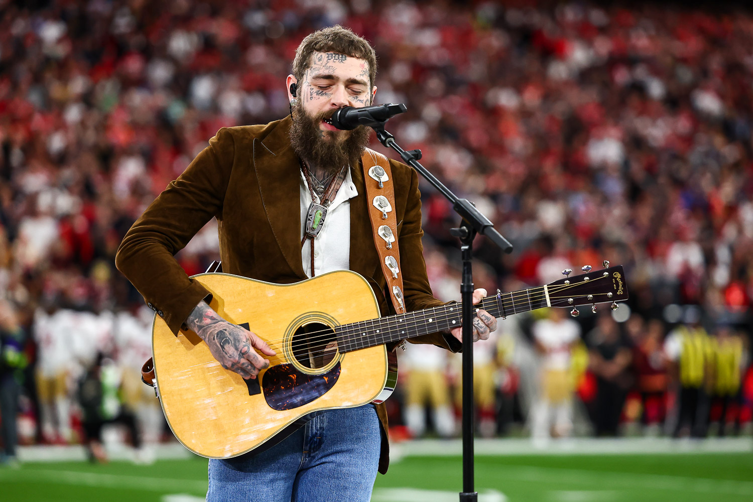 Post Malone sings “America the Beautiful” prior to the NFL Super Bowl 58 football game between the Kansas City Chiefs and the San Francisco 49ers, Sunday, Feb. 11, 2024, in Las Vegas.