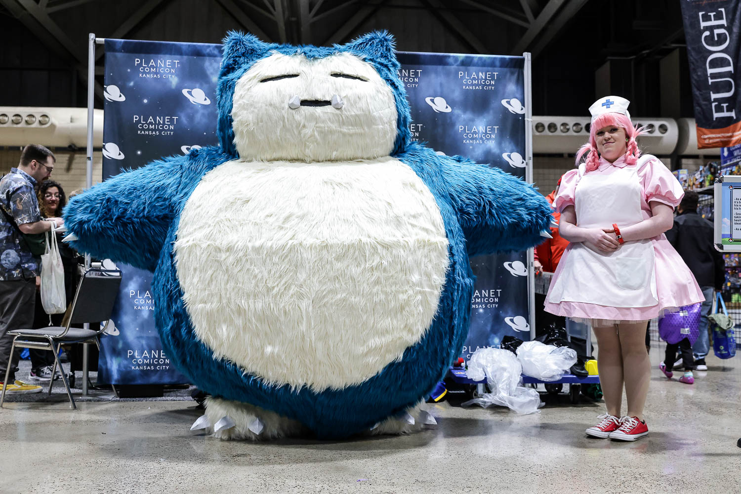 Pokemon Snorlax and Nurse Joy cosplayers on Saturday at the 2023 Planet Comicon in Kansas City, Missouri on March 18, 2023.