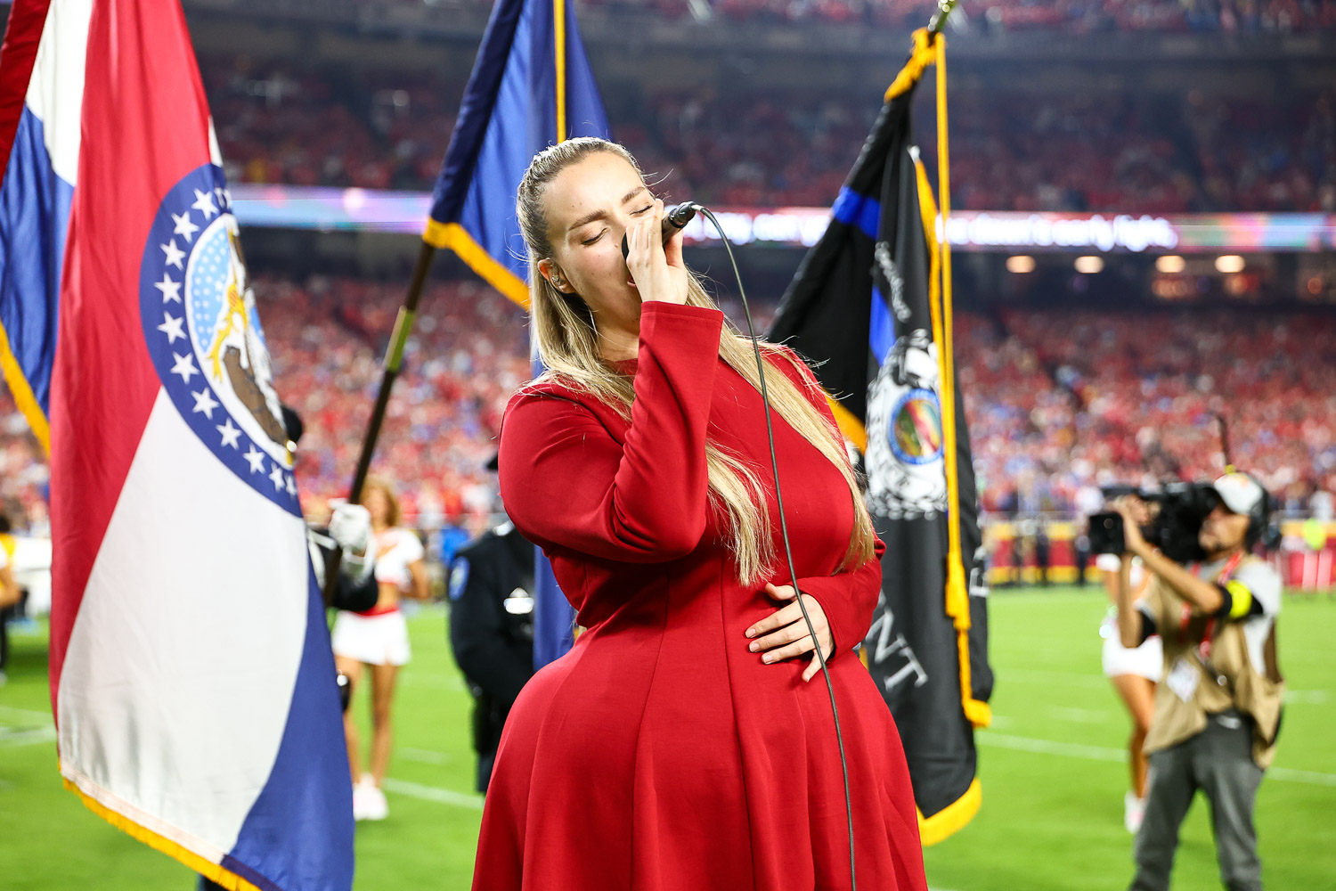Grace Kinstler singing the National Anthem prior to an NFL football game against the Detroit Lions, Sunday, October 12, 2025 in Kansas City.
