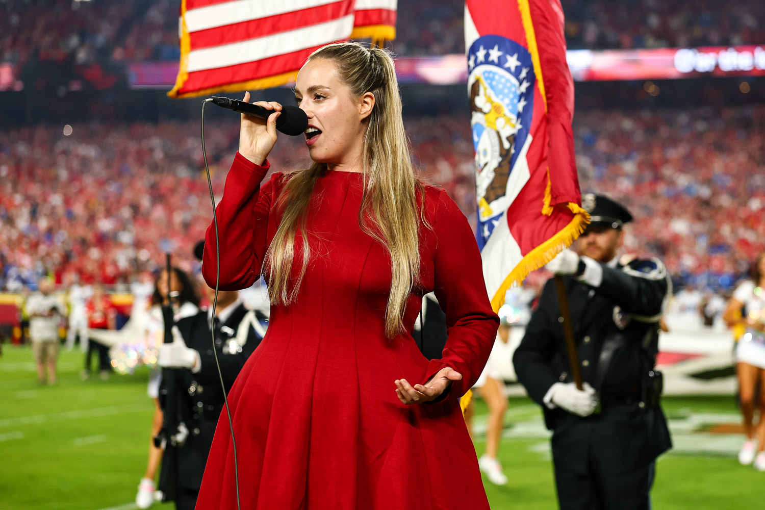 Grace Kinstler singing the National Anthem prior to an NFL football game against the Detroit Lions, Sunday, October 12, 2025 in Kansas City.