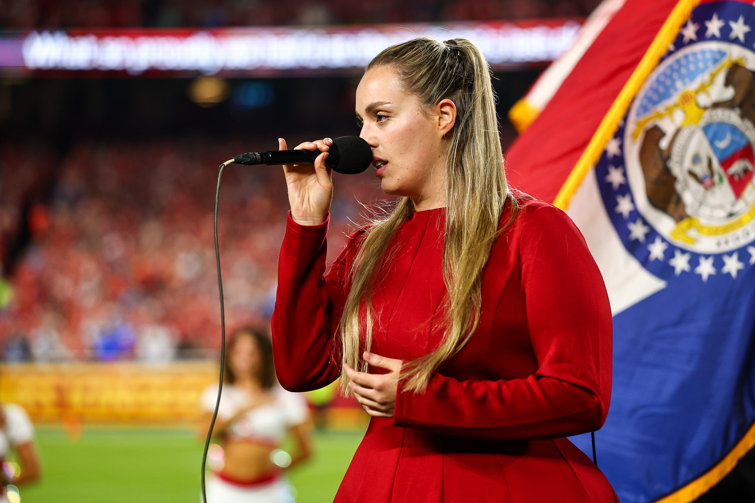 Grace Kinstler singing the National Anthem prior to an NFL football game against the Detroit Lions, Sunday, October 12, 2025 in Kansas City.