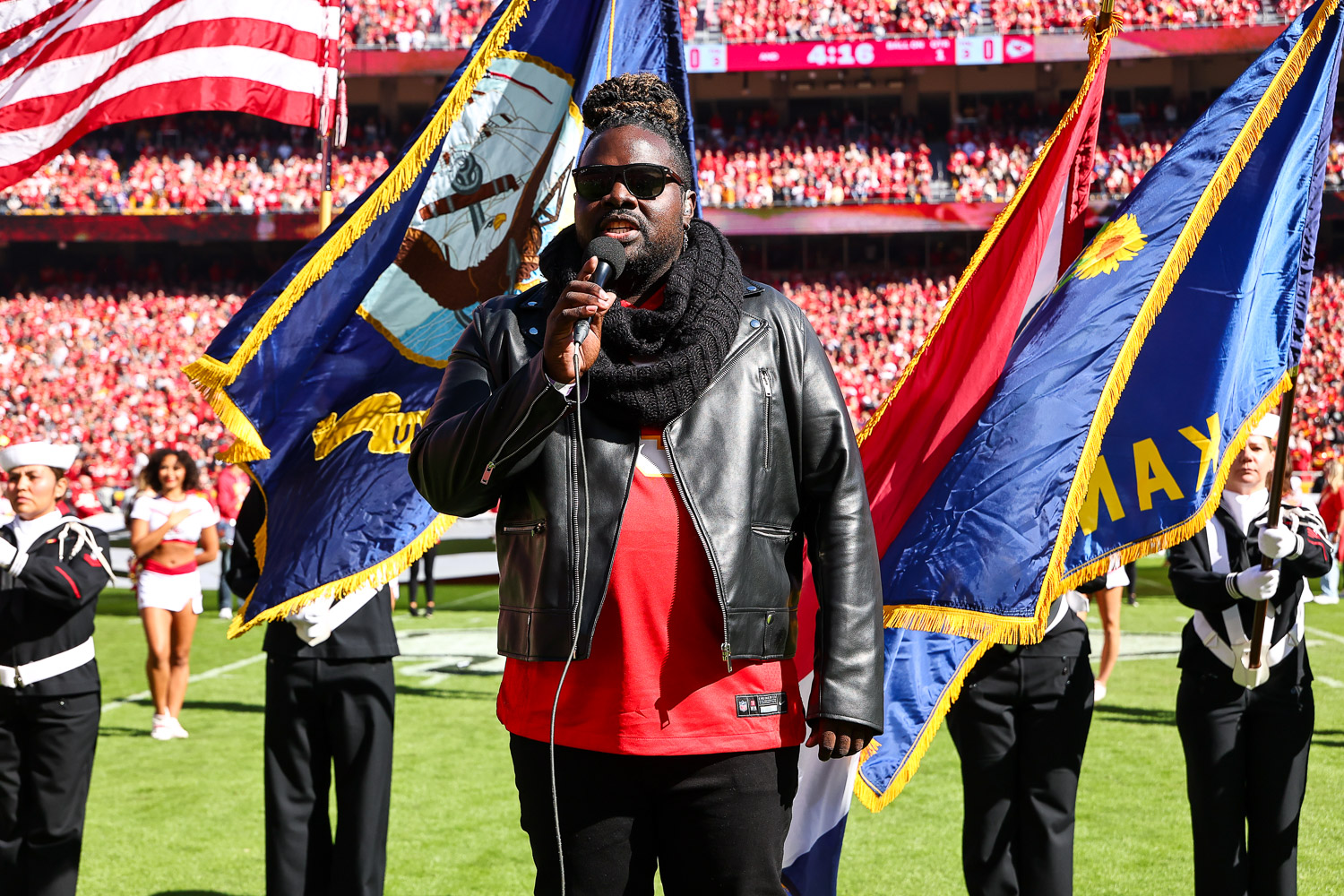 Pershard Owens sings the National Anthem prior to an NFL football game against the Las Vegas Raiders, Sunday, October 19, 2025 in Kansas City.