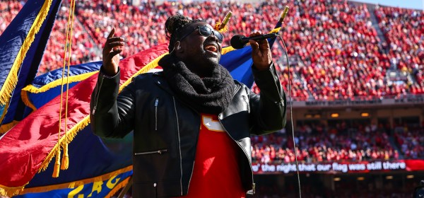 Pershard Owens sings the National Anthem prior to an NFL football game against the Las Vegas Raiders, Sunday, October 19, 2025 in Kansas City.