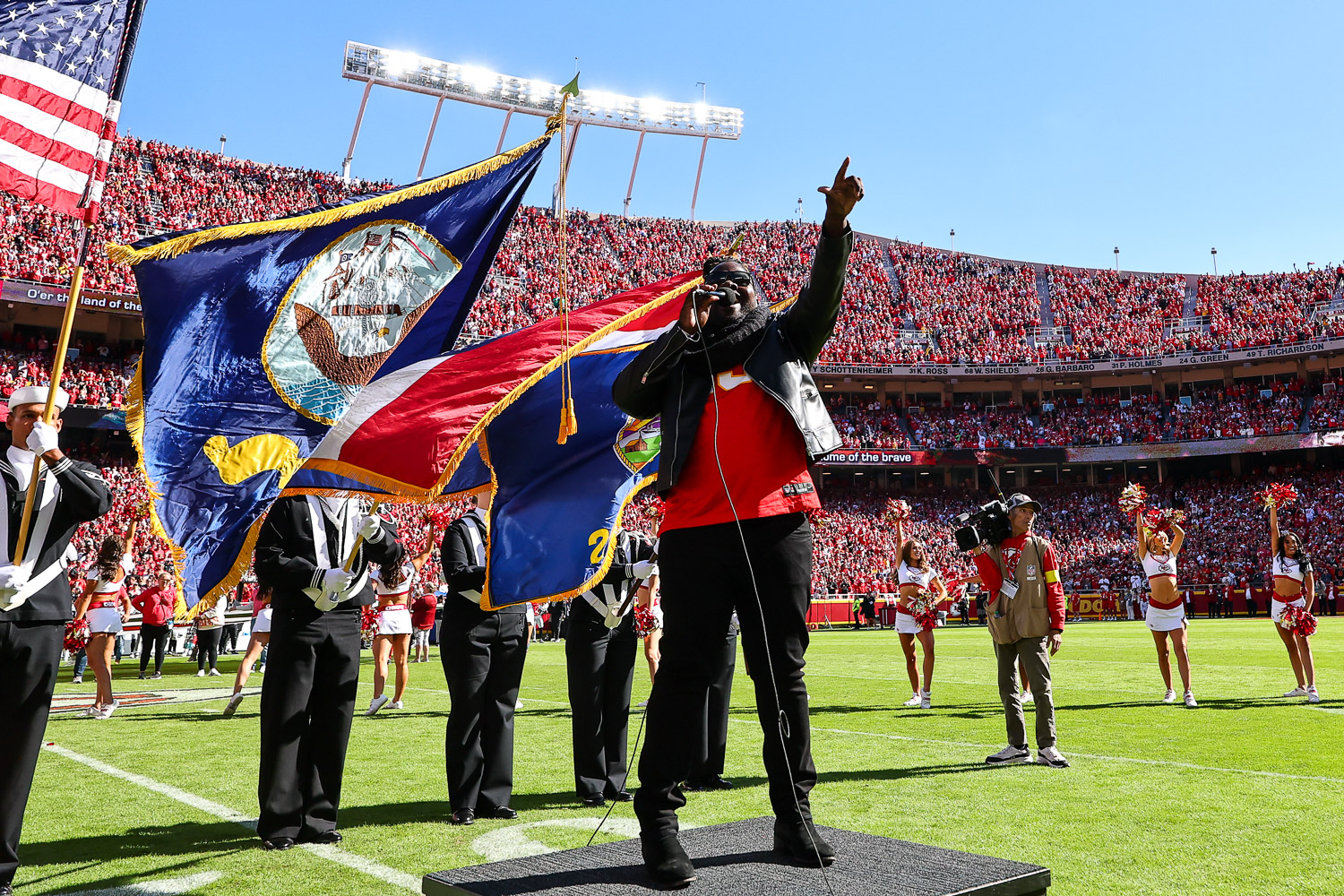 Pershard Owens sings the National Anthem prior to an NFL football game against the Las Vegas Raiders, Sunday, October 19, 2025 in Kansas City.