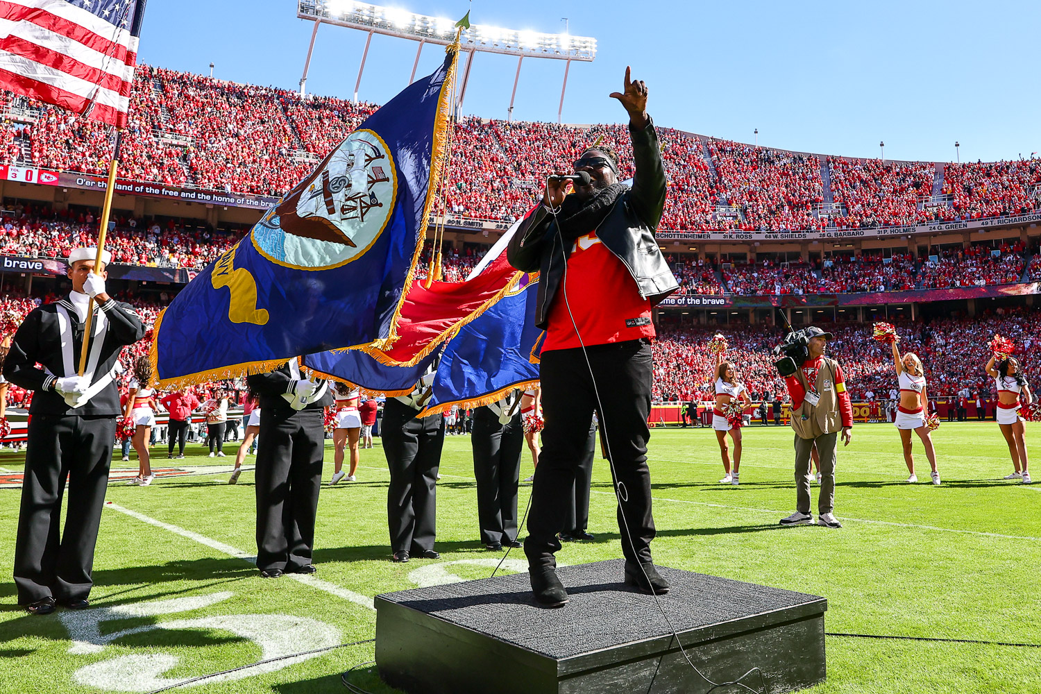 Pershard Owens sings the National Anthem prior to an NFL football game against the Las Vegas Raiders, Sunday, October 19, 2025 in Kansas City.
