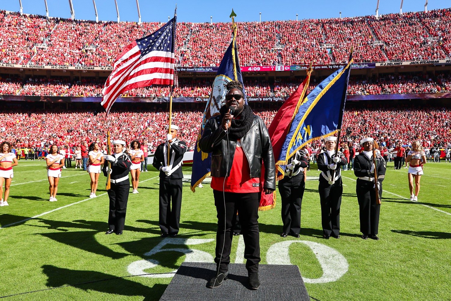 Pershard Owens sings the National Anthem prior to an NFL football game against the Las Vegas Raiders, Sunday, October 19, 2025 in Kansas City.