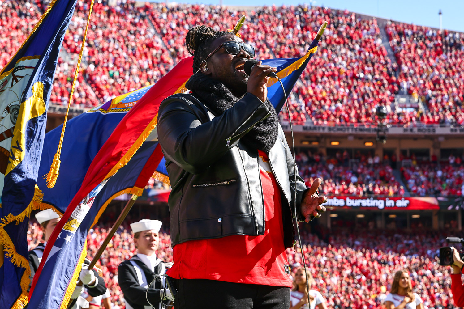 Pershard Owens sings the National Anthem prior to an NFL football game against the Las Vegas Raiders, Sunday, October 19, 2025 in Kansas City.