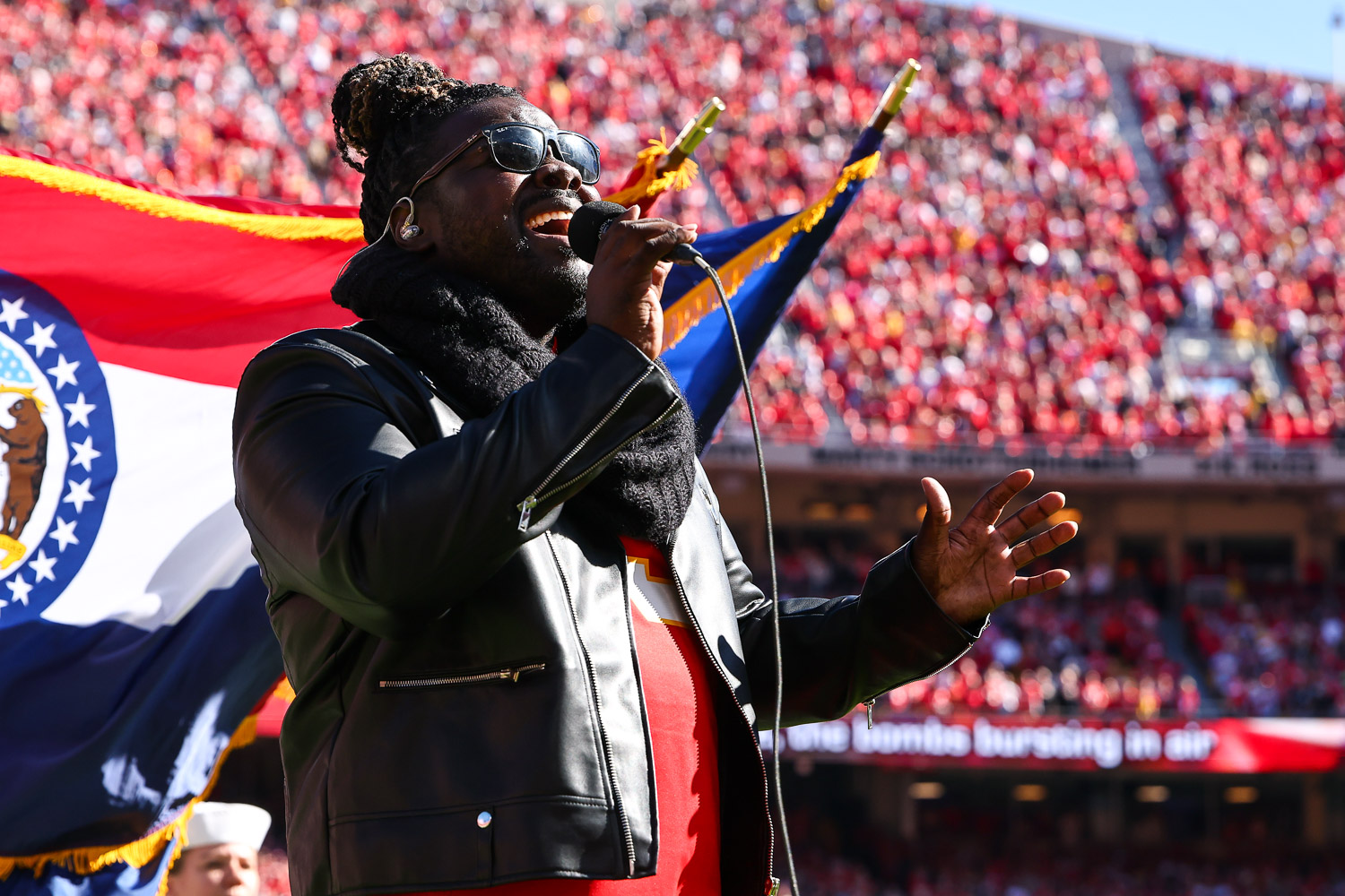 Pershard Owens sings the National Anthem prior to an NFL football game against the Las Vegas Raiders, Sunday, October 19, 2025 in Kansas City.